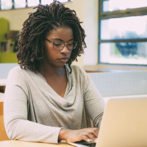 Focused,Student,Working,In,Library,Computer,Class.,Young,Black,Woman